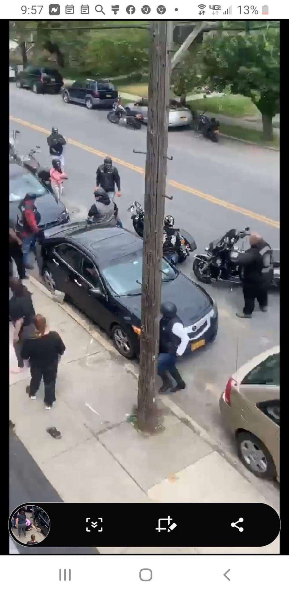Joseph P. Brady, a longtime legislative aide to a Brooklyn assemblyman, is pictured at right in this undated photo, his arms crossed, as members of his motorcycle club, East Coast Syndicate, are involved in a brawl on a Troy street. (Provided photo)