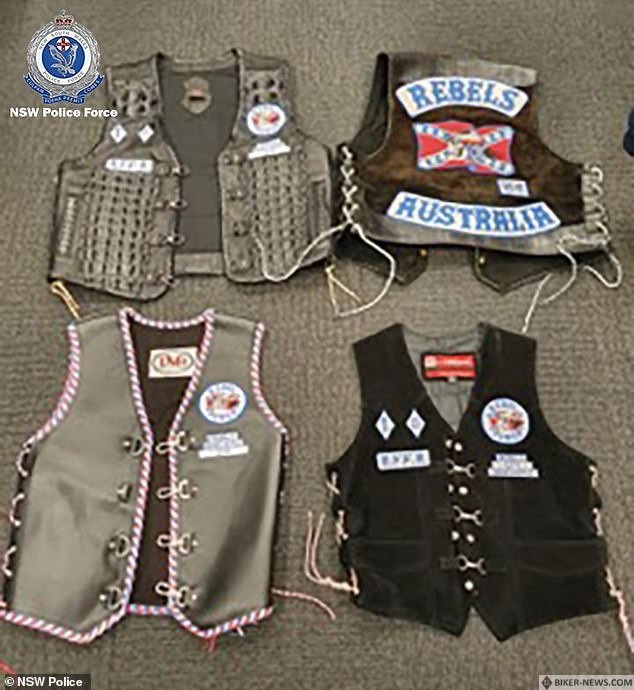 A senior member of the Rebels outlaw motorcycle club has been charged with 18 offences after a police raid found weapons, drugs, and 20 drums of suspected stolen diesel 