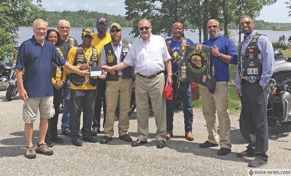 Pictured, back row, from left, are CMVA members Jack Cox and Alfred Grigler. Pictured, middle row, from left, are Buffalo Soldiers Treasurer Pamela Smith, Fort Rucker Buffalo Soldiers President Otis Smith, CMVA Commander Mark Moser and Buffalo Soldiers Vice President Anthony Knight. Pictured, front row, from left, are WWVC Chairman Tim Laster, WWVC Vice President Conrad Stempel, CMVA member Chris Foley and Buffalo Soldiers Secretary Tony Orr.
