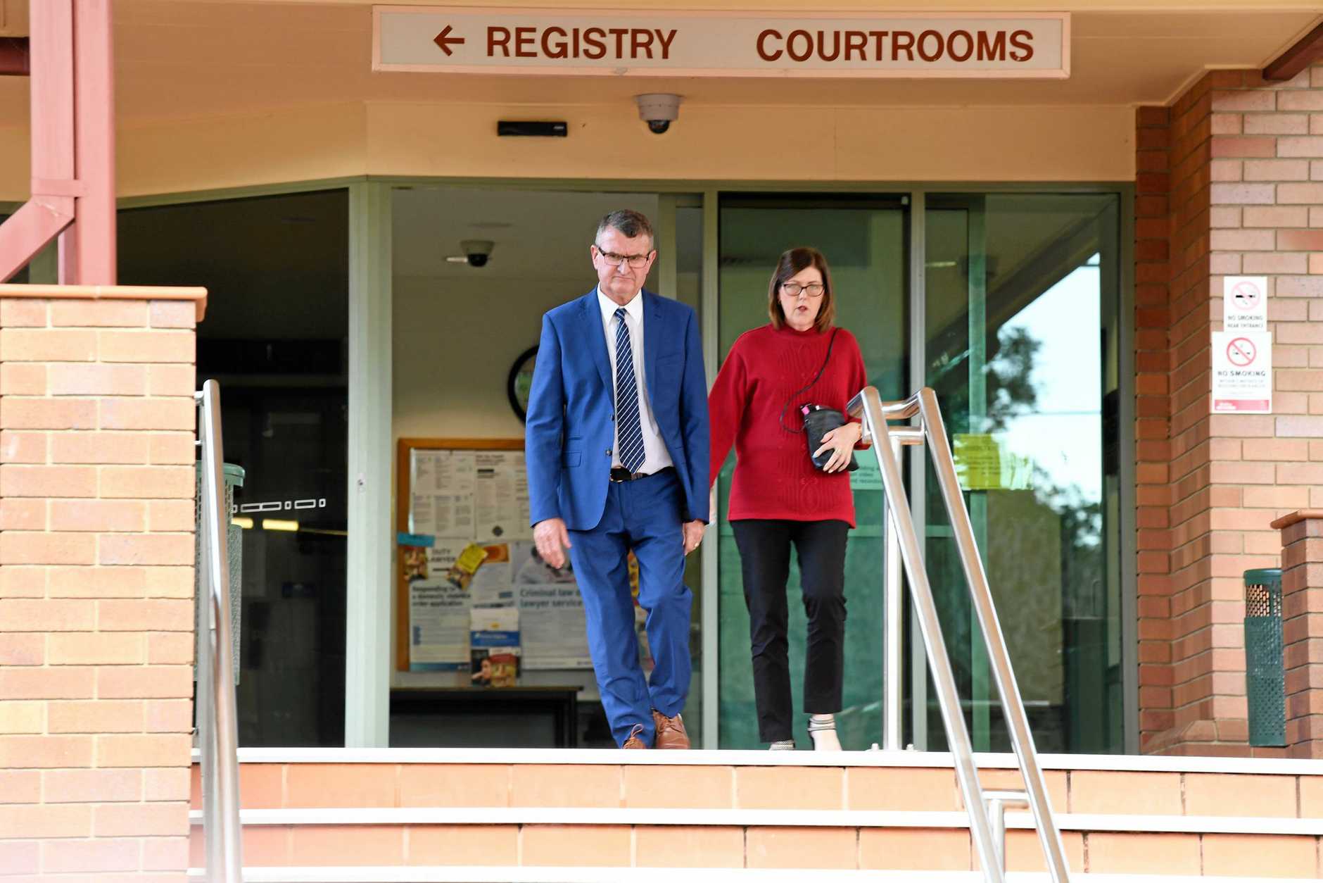 Patrick O'Sullivan with his wife leaving Hervey Bay District Court (29.07.19) after he received two sentences of 2.5 years imprisonment suspended for four years for each count of extortion.
