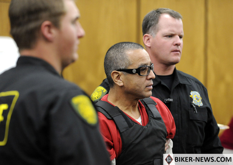 In this Nov. 17, 2011, file photo, Vagos motorcycle club member Ernesto Gonzalez is led from district court under heavy security in Reno, Nev., after pleading guilty in the shooting death of Hells Angels member Jeffrey “Jethrow” Pettigrew. Jury selection begins Monday, July 29, 2019, in federal court in Las Vegas for the racketeering trial of eight accused Vagos motorcycle club members, including Gonzalez, in a sweeping case stemming from the killing of a rival Hells Angels leader from California in a shooting at a northern Nevada casino nearly eight years ago. (David B. Parker/The Reno Gazette-Journal via AP)