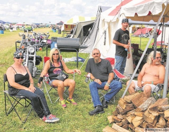 A group from Indiana relaxes at a campsite at last year’s Wetzelland. From left to right are Wendy Winget, Terri Bonjour, Kevin Bonjour, Mark Winget and Dustin Wingate.