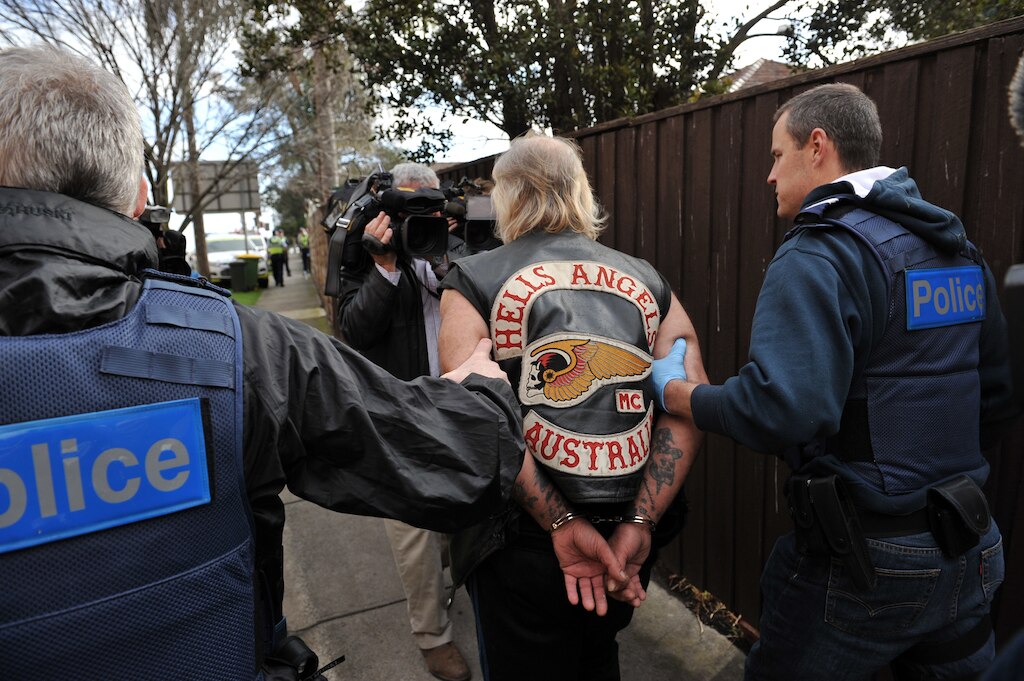 A senior Hells Angels member is arrested by Victoria Police in a raid on the bikie gang's Melbourne headquarters in 2012.