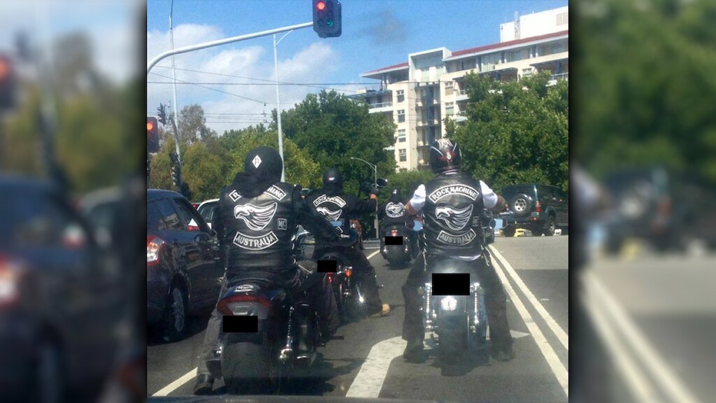 Rock Machine gang members photographed on the road.