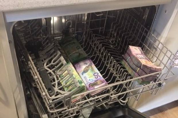 Customs investigators found cash in a dishwasher after seizing 100kg of methamphetamine. Photo / Supplied