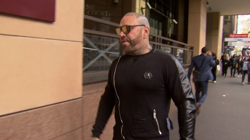Toby Mitchell leaving a court after having is community corrections order cancelled. (9News)