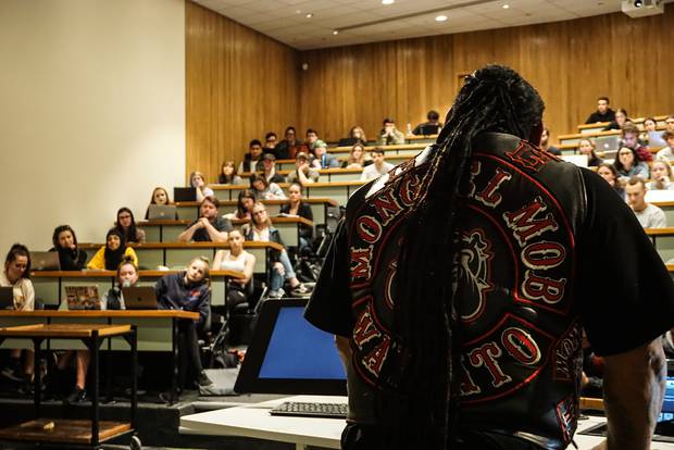 Sonny Fatu of the Hamilton Mongrel Mob chapter talks to Canterbury University criminal justice students. Photo / Katie Harris