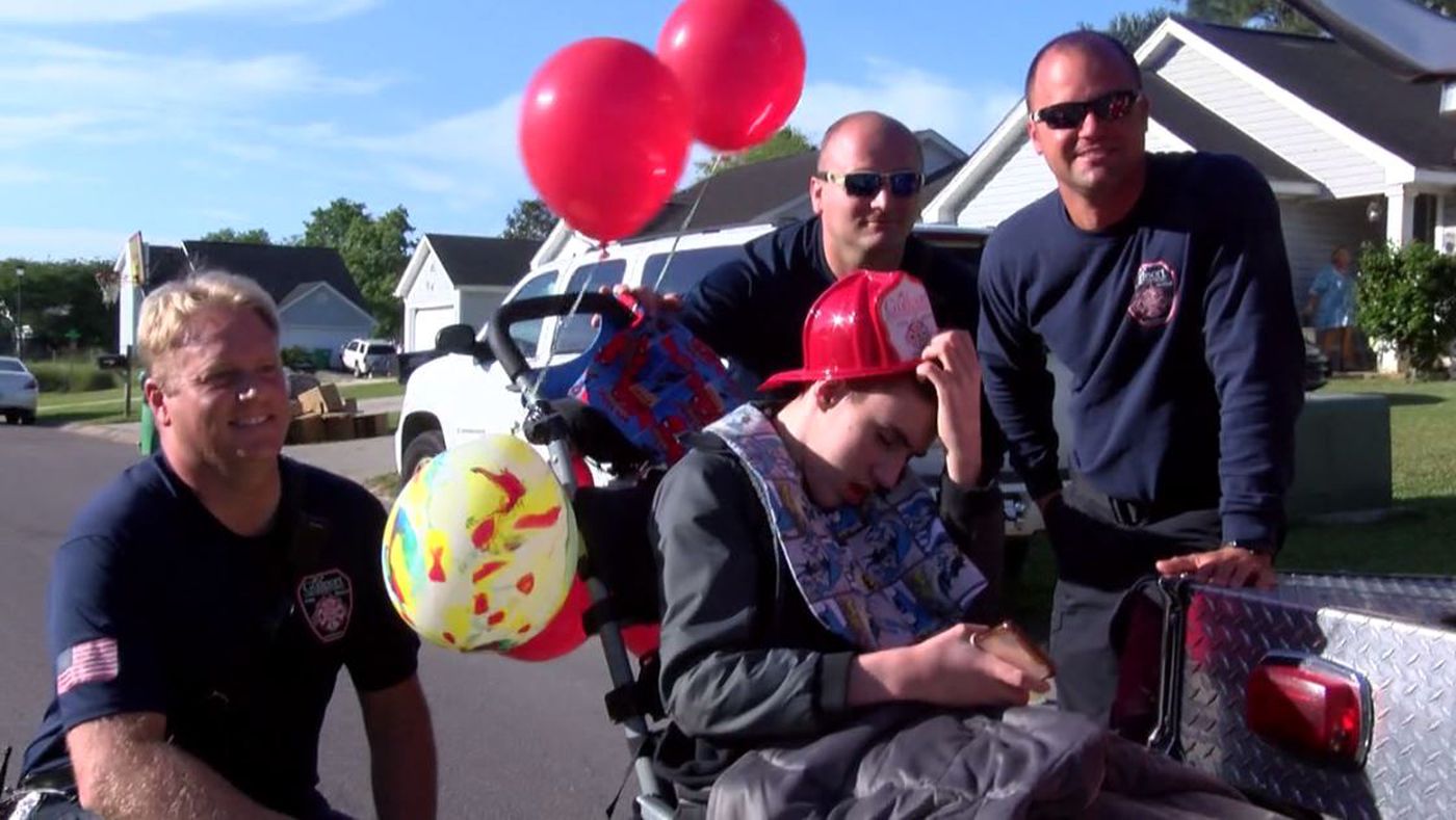 Firefighters with Gulfport Fire Department led the parade for 15-year-old Darian Huddleston.