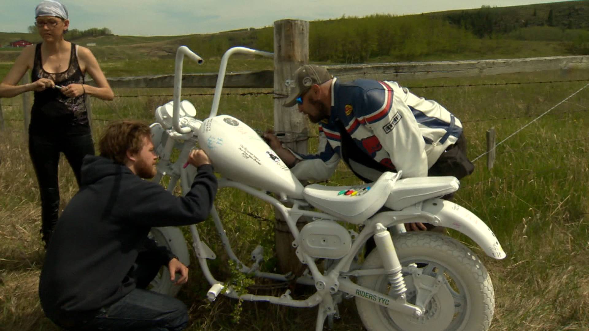 Riders share messages on the ghost bike memorial.