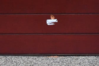 A bullet hole in the garage of the Kew home.