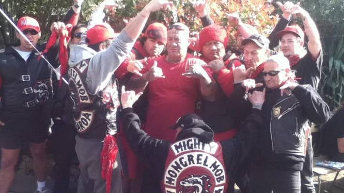 Joseph ‘Junior’ Wiringi, the president of the Mongrel Mob's Aotearoa chapter, surrounded by members of the gang.